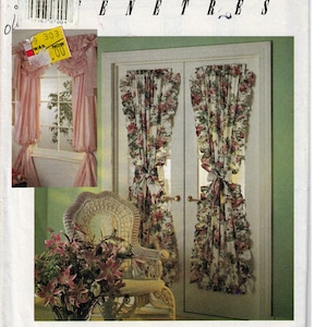 May include: A sewing pattern for window treatments, featuring a floral print fabric with ruffles. The pattern is from Simplicity House and is labeled "Windows & Entrees".