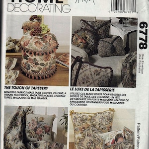 May include: A sewing pattern for home decor projects featuring a floral tapestry fabric. The pattern includes instructions for making a table cover, pillows, a throw, a footstool, a magazine holder, a storage tuffet, and a magazine or mail hanger. The pattern is called "The Touch of Tapestry".