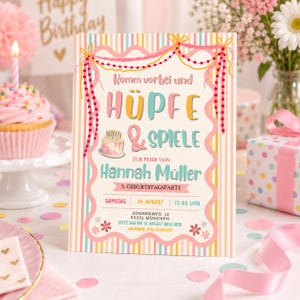 May include: A rectangular birthday party invitation card featuring vertical stripes in pastel colors, a scalloped border, and decorative hanging beads. The text reads: Komm vorbei und H&Uuml;PFE & SPIELE ZUR FEIER VON Hannah M&uuml;ller 5. GEBURTSTAGSPARTY.