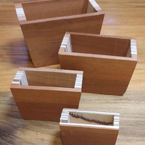 Handcrafted Cherry with pine strip miniature nesting keepsake stackable boxes.set of 4 .