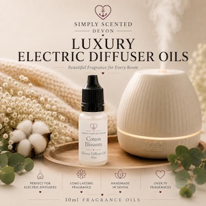 May include: A 10ml bottle of Cotton Blossom electric diffuser oil with a black cap and white label, positioned next to a white, ribbed electric diffuser emitting mist. The text reads Simply Scented Devon Luxury Electric Diffuser Oils.