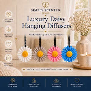 May include: Four hanging daisy-shaped diffusers with yellow centers and white, grey, pink, and blue petals, each attached to a black ribbon. The text reads Simply Scented Devon Luxury Daisy Hanging Diffusers Handcrafted Fragrance for Every Home.