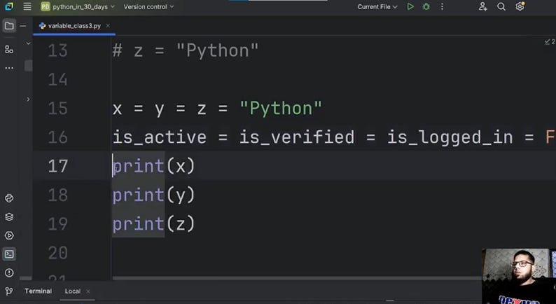 May include: A computer screen displaying Python programming code in a dark mode editor. The code includes variable assignments such as x = y = z = "Python" and print statements for x, y, and z. A person is visible in the bottom right corner.