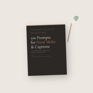 May include: A dark brown book titled "100 Prompts for Social Media & Captions" with text in white and a copper-colored border. The book is part of the "Digital Collection" and is optimized for Claude AI. The book is for content creators, marketers, and small business owners.