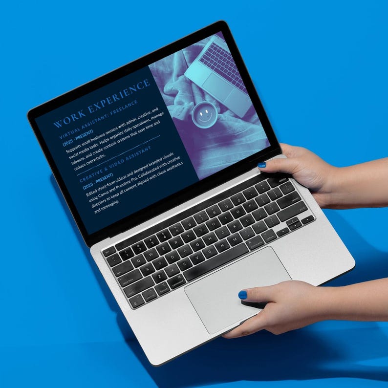 May include: A silver laptop displaying a resume titled "WORK EXPERIENCE" with text describing virtual assistant and creative video assistant roles. The laptop is held by hands against a bright blue background.
