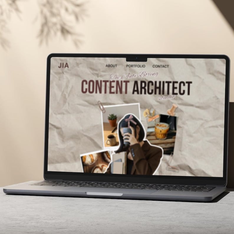 May include: A laptop displaying a website with the text "CONTENT ARCHITECT" in brown. The screen shows a collage of images, including a person holding a drink, a plant, and food items. The laptop is on a gray surface.