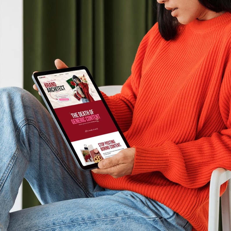May include: A person holding a tablet displaying a website with the text "Brand Architect" and "The Death of Generic Content." The website features images and a red and white color scheme. The person is wearing an orange sweater and blue jeans.