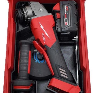 May include: A red and black power tool set, including an angle grinder and battery, stored in a red toolbox. The angle grinder has the word "FUEL" printed on it. The battery is labeled "M18 REDLITHIUM XC5.0".