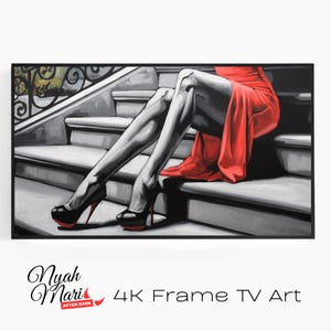 May include: A framed artwork depicting a woman in a red dress and black high heels sitting on a staircase. The artwork is primarily black, white, and red, with the woman's legs and dress as the focal point. The heels have red soles.