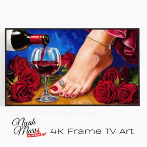 May include: A framed artwork depicts a wine bottle pouring red wine into a glass, with a foot wearing a ring and anklet. Red roses are scattered around the glass. The artwork is labeled "Nyah Mari After Dark 4K Frame TV Art."