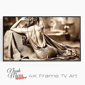 May include: Sepia-toned artwork featuring a woman in a flowing, backless dress, seated with her back to the viewer. The dress cascades onto a textured surface. The artwork is framed in black, with the text "4K Frame TV Art" at the bottom.