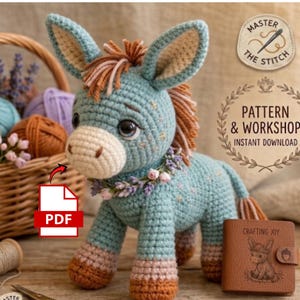May include: A crocheted donkey in shades of blue, brown, and pink, with a floral garland around its neck. The donkey has large eyes and a fluffy mane. A PDF icon is visible. The image also includes a basket of yarn and a leather wallet.