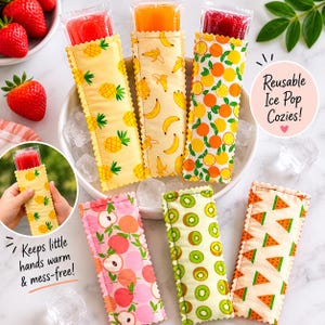 May include: A selection of reusable ice pop cozies featuring fruit designs such as pineapple, banana, orange, peach, kiwi, and watermelon. The cozies are designed to keep hands warm and mess-free. The image also shows ice pops.