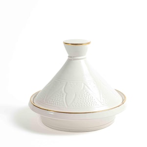 May include: A white ceramic tagine pot with a conical lid and a round base. The lid features embossed floral patterns and is trimmed with gold. The base also has a gold trim. This traditional cookware is designed for slow-cooked stews.