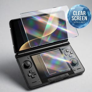 May include: A black handheld gaming console with a clear screen protector overlay. The screen protector is transparent and reflects light, with the text "CLEAR SCREEN ULTRA CLARITY" in a blue circle. The console has buttons and a joystick.