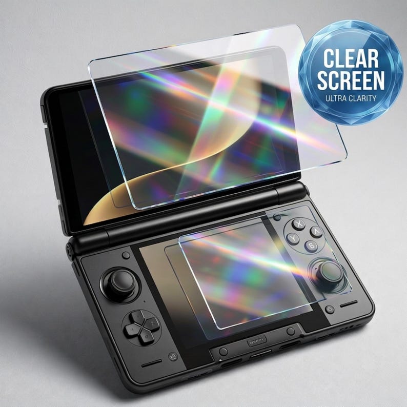 May include: A black handheld gaming console with a clear screen protector overlay. The screen protector is transparent and reflects light, with the text "CLEAR SCREEN ULTRA CLARITY" in a blue circle. The console has buttons and a joystick.
