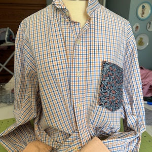 Upcycled Izod men’s shirt with ruffled collar and contrasting pocket made from vintage sheet.