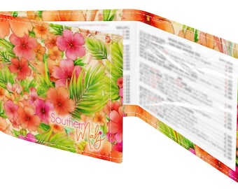 May include: Open wallet with a floral design featuring pink and orange flowers, green leaves, and the text "Southern Maui". The wallet is open, revealing blurred text on the inside.