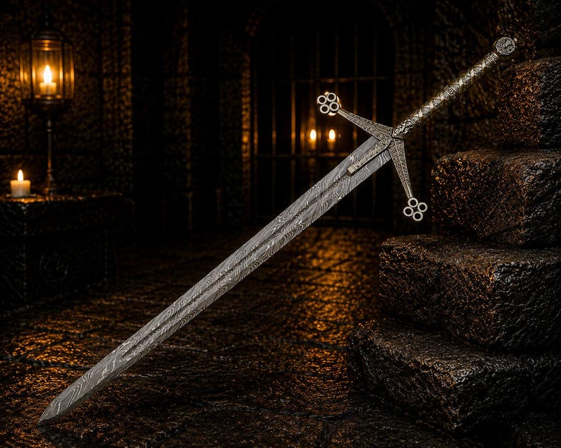 May include: A long sword featuring a double-edged blade with a distinct wavy Damascus steel pattern. The metal crossguard and pommel are intricately detailed with circular quatrefoil motifs, and the grip is wrapped in a textured metallic material.