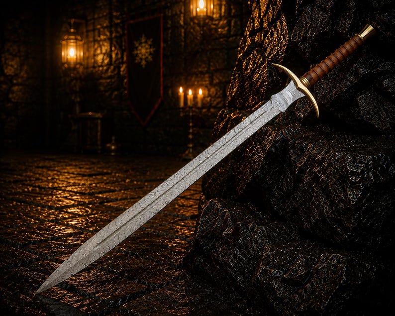 May include: A double-edged sword featuring a patterned Damascus steel blade, a gold-toned metal crossguard, and a brown leather-wrapped grip with a gold-toned pommel. The blade displays a distinct wavy, layered metal texture throughout its length.