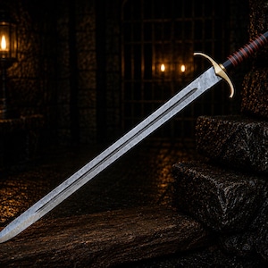 May include: A double-edged sword with a patterned steel blade, a gold-coloured crossguard, and a black handle wrapped with thin red bands. The pommel is gold-coloured, and the blade features a central fuller running down the length of the metal.