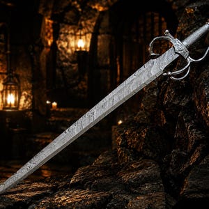 May include: A double-edged sword featuring a distinct wavy Damascus steel pattern on the blade. The hilt includes a silver-toned metal crossguard with curved quillons and a textured grip, showcasing intricate metalwork details on the pommel.