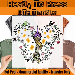 May include: A DTF transfer featuring a floral design with a tower, lanterns, and a character's hair. The design includes a purple tower, yellow lanterns, and a green chameleon. The text at the top says "Ready To Press DTF Transfer".