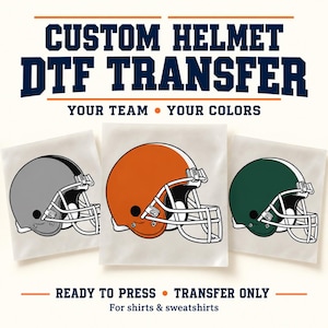 May include: Custom Helmet DTF Transfer featuring three football helmet graphics in gray, orange, and dark green with white face masks. The text reads CUSTOM HELMET DTF TRANSFER, YOUR TEAM YOUR COLORS, READY TO PRESS TRANSFER ONLY, For shirts & sweatshirts.
