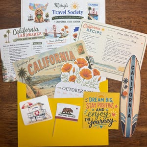 May include: A collection of California-themed paper items including a Maisy's Travel Society letter, a landmarks activity sheet, a citrus olive oil cake recipe card, a postcard, a calendar page, a surfboard cutout, and a yellow envelope with stickers.