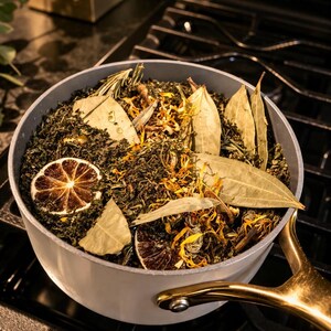 May include: A set of three ceramic mugs with a speckled, matte finish. The mugs are in shades of cream, light gray, and dark gray. Each mug has a simple, minimalist design, perfect for coffee or tea.