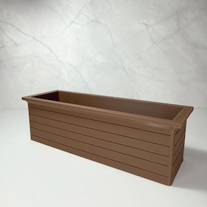 May include: A brown rectangular planter box with a ridged design. The planter has a raised rim and is empty. The box is made of a solid material and is suitable for indoor or outdoor use.