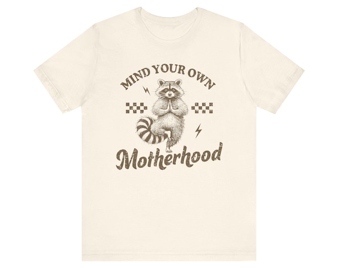 Mind Your Own Motherhood Oversized Mom Tee | Retro Raccoon Checkerboard Design