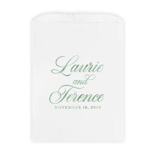 May include: White favor bag with a green script font design that reads "Laurie and Terence" and "November 19, 2026".