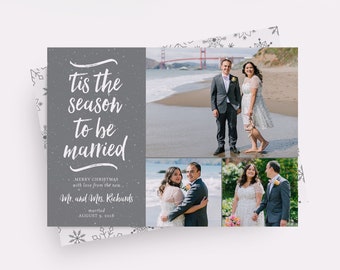 May include: A Christmas card with a gray background and white text that says "tis the season to be married." The card also includes a photo of a couple on their wedding day. The text below the photo says "Merry Christmas with love from the new Mr. and Mrs. Richards married August 9, 2018."