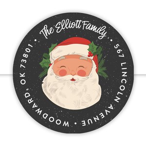 May include: Round black and white Christmas return address label with a cartoon image of Santa Claus. The text reads "The Elliott Family", "567 Lincoln Avenue", "Woodward, OK 73801".