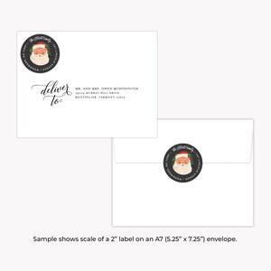 May include: A white envelope with a black and white Santa Claus sticker. The envelope has a handwritten address label that reads "deliver to" followed by a name and address. The text "Sample shows scale of a 2" label on an A7 (5.25" x 7.25") envelope." is printed below the envelope.
