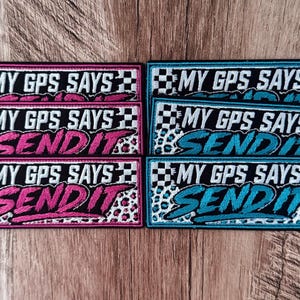 May include: Six rectangular embroidered patches featuring a black and white checkered pattern on the left and a leopard print background. The text MY GPS SAYS is in white, and the word SEND IT is in either bright pink or bright blue thread.