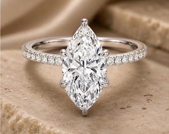 Anel de noivado com diamante cultivado em laboratório em formato de marquise, halo oculto, aro pavé, cravação com seis garras, certificado pelo IGI.