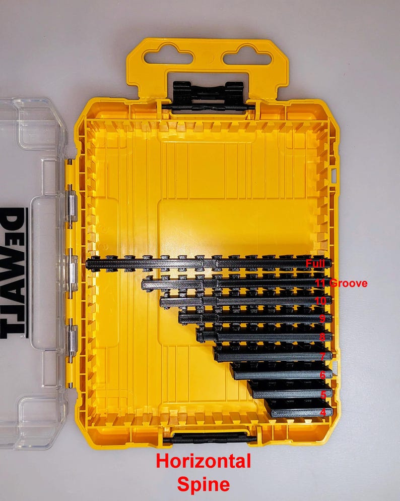 May include: Yellow and black tool organizer case, open to reveal black tool holders. The case has a handle and a clear plastic lid. Text on the case reads "Horizontal Spine" and "Full Groove".