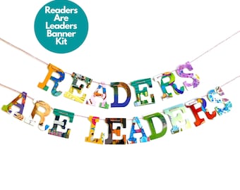 May include: A colorful banner made of book pages that reads "Readers Are Leaders". The banner is strung on a white string with red accents. The banner is perfect for a classroom or library.