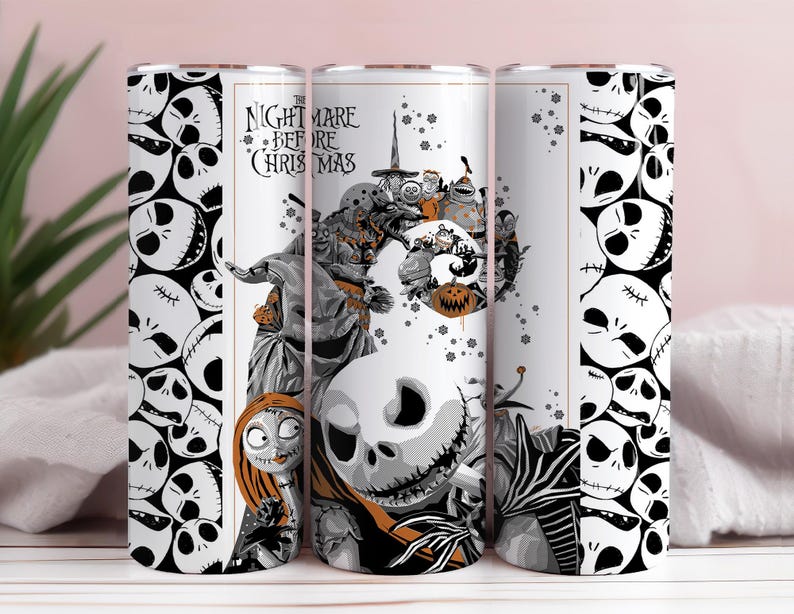 May include: A white tumbler featuring characters and imagery from "The Nightmare Before Christmas." The design includes Jack Skellington, Sally, and other characters in a black and white color scheme, with orange accents. The text "The Nightmare Before Christmas" is also visible.