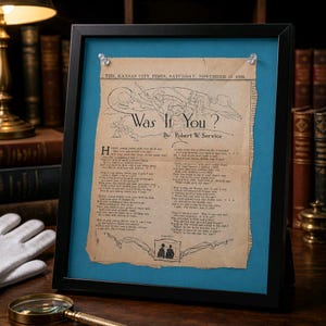 May include: A framed vintage newspaper clipping titled Was It You? by Robert W. Service, dated November 11, 1922. The aged, tan paper features a black ink illustration of a soldier and printed poetry, secured with two clear pins against a blue mat.