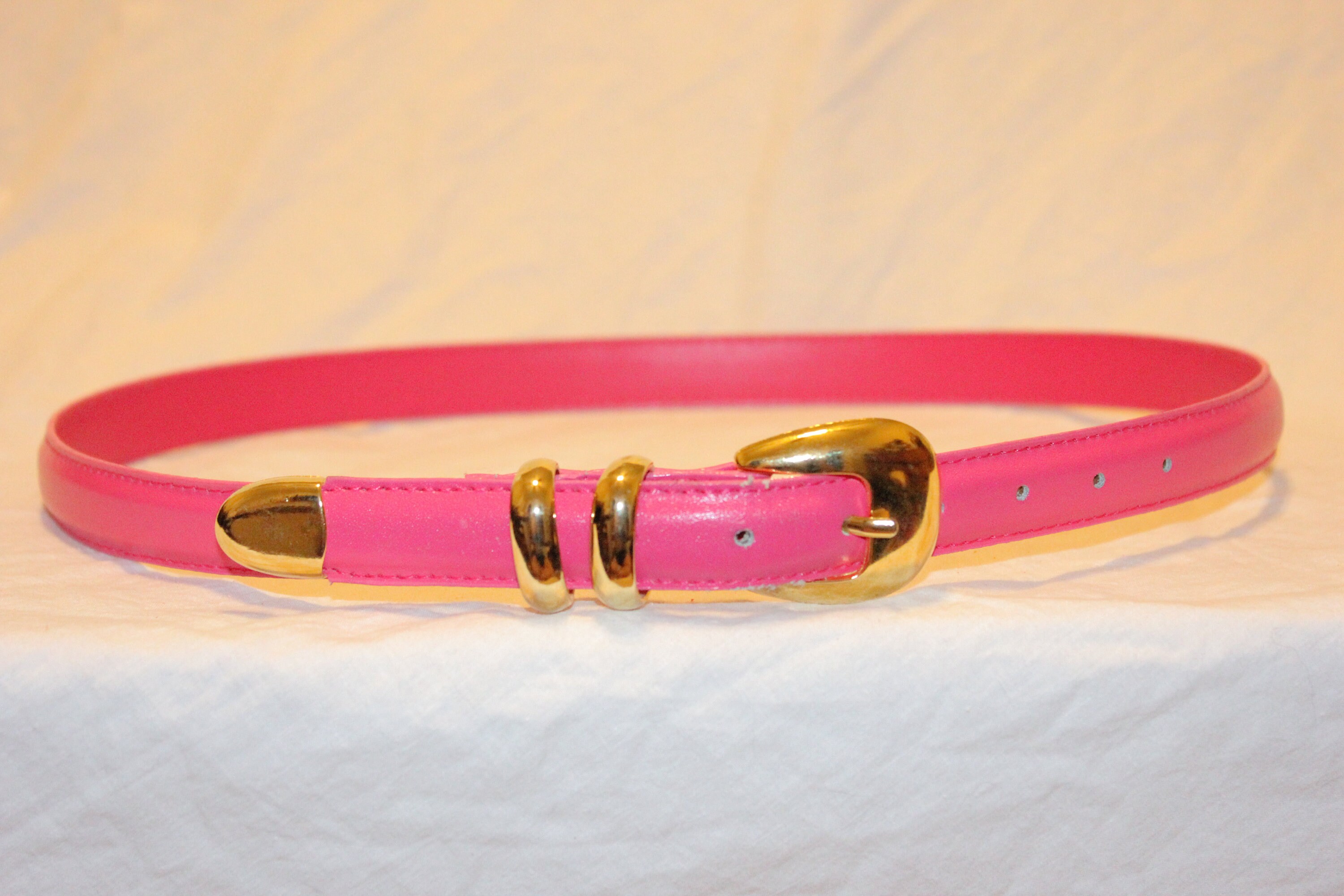 thin pink waist belt