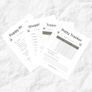 May include: Four white paper sheets with headings: "Puppy Pr", "Shoppi", "Traini", and "Potty Tracker". The sheets have paw print icons and are designed for pet owners to track information, including pet info, shopping lists, training progress, and potty habits.