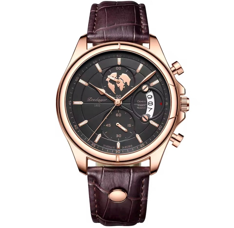 May include: A rose gold wristwatch with a dark gray face and a brown leather band. The watch face features a world map design and the text "Loedagar 1853". The watch has three sub-dials and a date display. The band is textured and has a buckle closure.