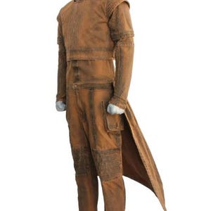 May include: A brown costume with a long coat-like back panel, long sleeves, and pants. The outfit has a textured appearance with visible stitching and a pocket on the pants. The costume is displayed on a mannequin.