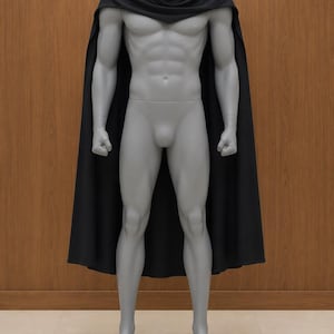 May include: A solid black cape featuring a draped cowl neckline that rests over the shoulders. The garment is displayed on a grey, muscular, full-body mannequin, extending down the back to create a long, flowing silhouette with clean edges.