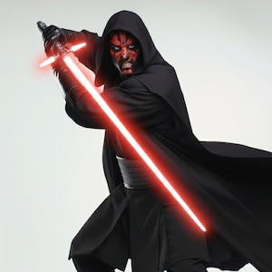 May include: A figure in a black hooded cloak and trousers, holding a red double-bladed lightsaber. The character has red and black facial markings and black gloves. The lightsaber is glowing red.