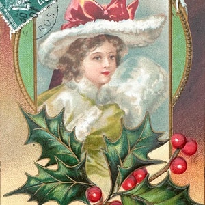 Antica cartolina francese raffigurante una donna affascinante e il suo cappellino che ti augura una Bonne Année