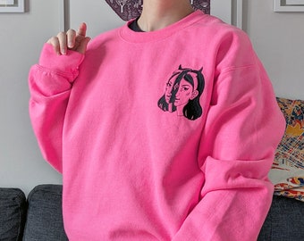 Embroidered long sleeve shirt | hot pink and black | surrealist art from montreal | devil girl